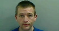 Policeman's throat cut in street attack - as officers search for wanted man