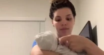Mum demonstrates how to hold a baby to stop them crying instantly