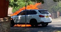 Hero dad pulls his son, 4, from burning car 'seconds' before it explodes in fireball
