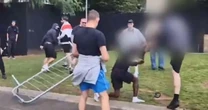 Black man kicked and punched by mob throwing fences in shocking riot footage