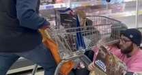 Fuming shoppers try to ram Animal Rising protesters with their Sainsbury's trolleys during sit-in