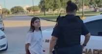 Chilling moment girl, 11, is hauled away in handcuffs by cops over prank call
