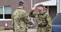 Prince William sports full military uniform as he meets British troops on Russia border