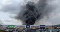 Massive blaze in Altrincham sends smoke billowing over retail park