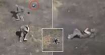 Moment Russian soldier hurls machine gun at killer drone triggering explosion