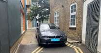 Dozy driver parks on TWO sets of double yellow lines in one of London's narrowest dead-ends