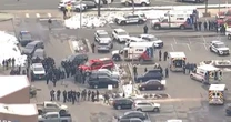 Gunman opens fire in supermarket car park before entering building as cops rush to scene