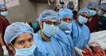 Man's 'stomach ache' turns out to be 2st 10lb tumour that took 10 doctors to remove