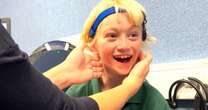 Moment adorable boy hears clearly for the first time as hearing aid switches on