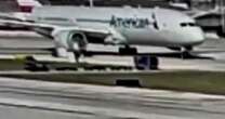 Horror as airplane engine sucks up luggage truck and rips it apart in front of passengers