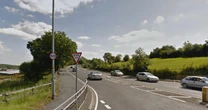 Woman robbed of BMW by two men in layby after stopping to read text message