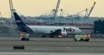 Terrifying moment flames roar from FedEx plane engine taking off at Newark