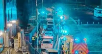 Man dies after 'falling from height' as police execute warrant at apartment buildingGreater Manchester Police
