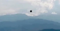 'Stunning' new UFO footage captures sphere-shaped object zig-zagging over city