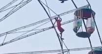 Teen girl dangles from huge Ferris wheel after falling out of pod in fairground horror