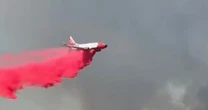Horror as 50km out-of-control bushfire surrounds entire town leaving hundreds trapped