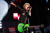 Green Day brings Oasis fan onto stage to play song and it goes very wrong