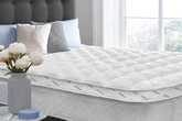 I spotted a 'thick' mattress topper that shoppers say is like 'sleeping on a cloud'