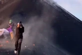 Terrified tourists pelted with red-hot lava as volcano they were hiking up suddenly erupts