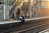 Youths help woman get phone back from railway track – then steal it themselves