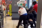England fan breaks up wild brawl as chaos erupts at Iceland supermarket checkouts