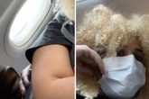 Horrified plane passenger films man 'touching her boob' from seat behind