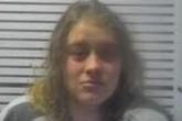 'Totally naked' woman arrested after being spotting driving car 'erratically'