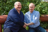 Putin's bromance with fellow war-mongerer exposed as pair pose for bizarre bench images
