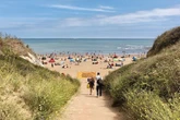 Naked bloke seen 'performing lewd act' while 'doing laps' of nudist beach
