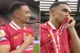 Trent Alexander-Arnold kisses the Liverpool badge during final Reds appearance