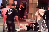 Mass brawl breaks out in Manchester city centre after man slammed onto bonnet