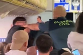 'Drunk' Ryanair passenger beaten with baton after 'punching cop in lover's tiff'
