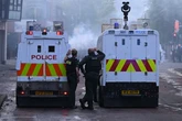 UK's night of rage as masked gangs set streets on fire and cops flee in terror