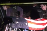 Two body bags draped with US flags found after residents hear 'two bangs'