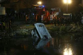 At least 18 dead and nine injured after bus plummets from bridge into river