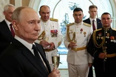 Putin downs champagne while surrounded by seamen as he makes 'bottom of my heart' declaration