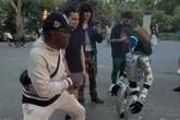 Viral robot filmed 'throwing punches' at people in the street before 'roasting them'