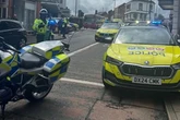 Police swarm UK street as two air ambulances land with a third 'on the way'