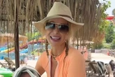 Amanda Holden bares legs in zip-up swimsuit for 'adult baby' trend with TV pal