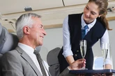 Drunk air hostess ‘lifted up top’ and told worker to 'have a go on these funbags'