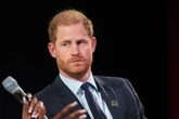 Prince Harry hurried out of court by bodyguards as woman screams at him