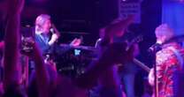 Man steps onto stage at gig – people's jaws drop when they realise who he actually is