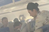 Passengers told 'stay calm and don't panic' as cabin fills with smoke during flight