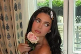 Kylie Jenner strips naked in bed and kisses pink rose in steamy display