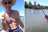 Stunned fishermen spot something snagging on line and reel in fearsome 2-metre creature