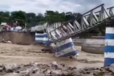 Massive landslide kills 24, including 7 children, as video shows building collapse into river