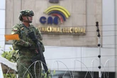 Five dead and girl, 2, injured as gunmen open fire on group watching football match