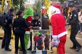 Santa Claus and The Grinch street brawl caught on camera as shocked kids look on