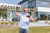 Cabbie swaps council flat for £4m beach house and celebrates with one thing