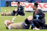 Footballer's wife responds after fans spot physio giving her husband a good rub
